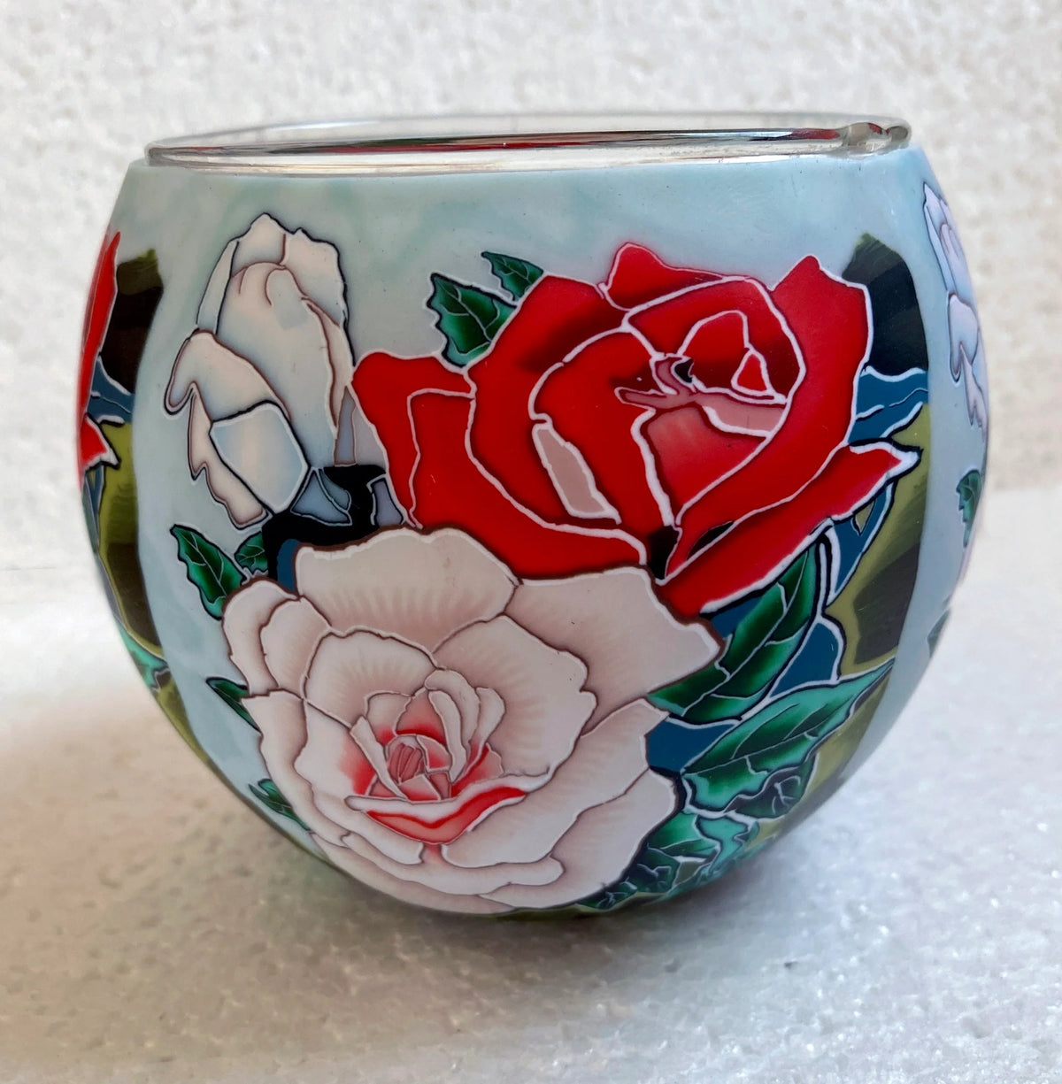 Claymaster Roses light globe with a red and cream rose bouquet in raised relief on a pale blue background