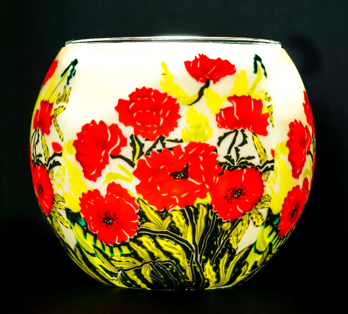 Classic Poppies Claymaster light globe glowing softly with red poppies over a warm white background and green foliage at the base