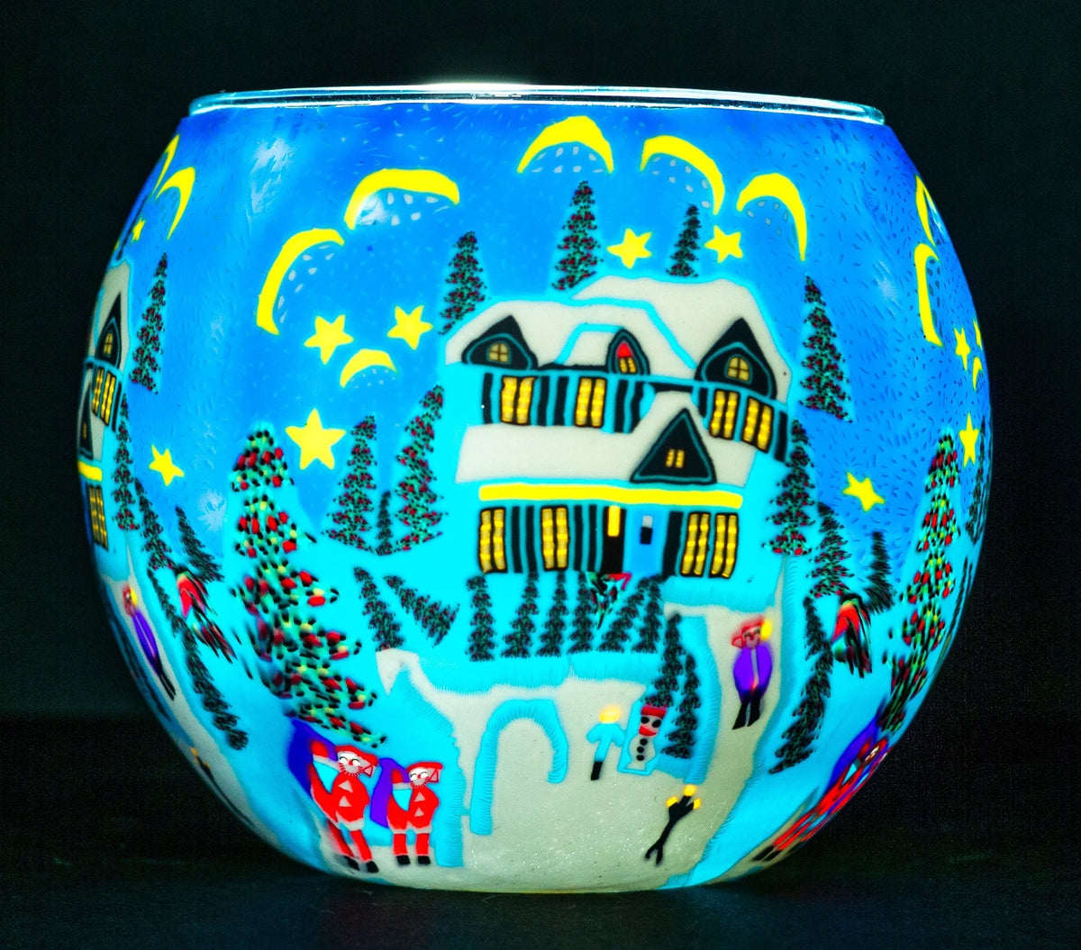 Snowed In Claymaster light globe glowing with a folk-art winter night scene of a snow-covered house, pines and figures in red coats
