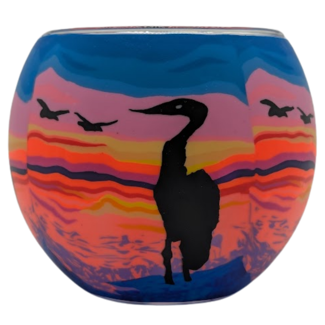 Heron Sunset Claymaster light globe with a black heron silhouette against layered pink, coral, orange and violet sunset bands