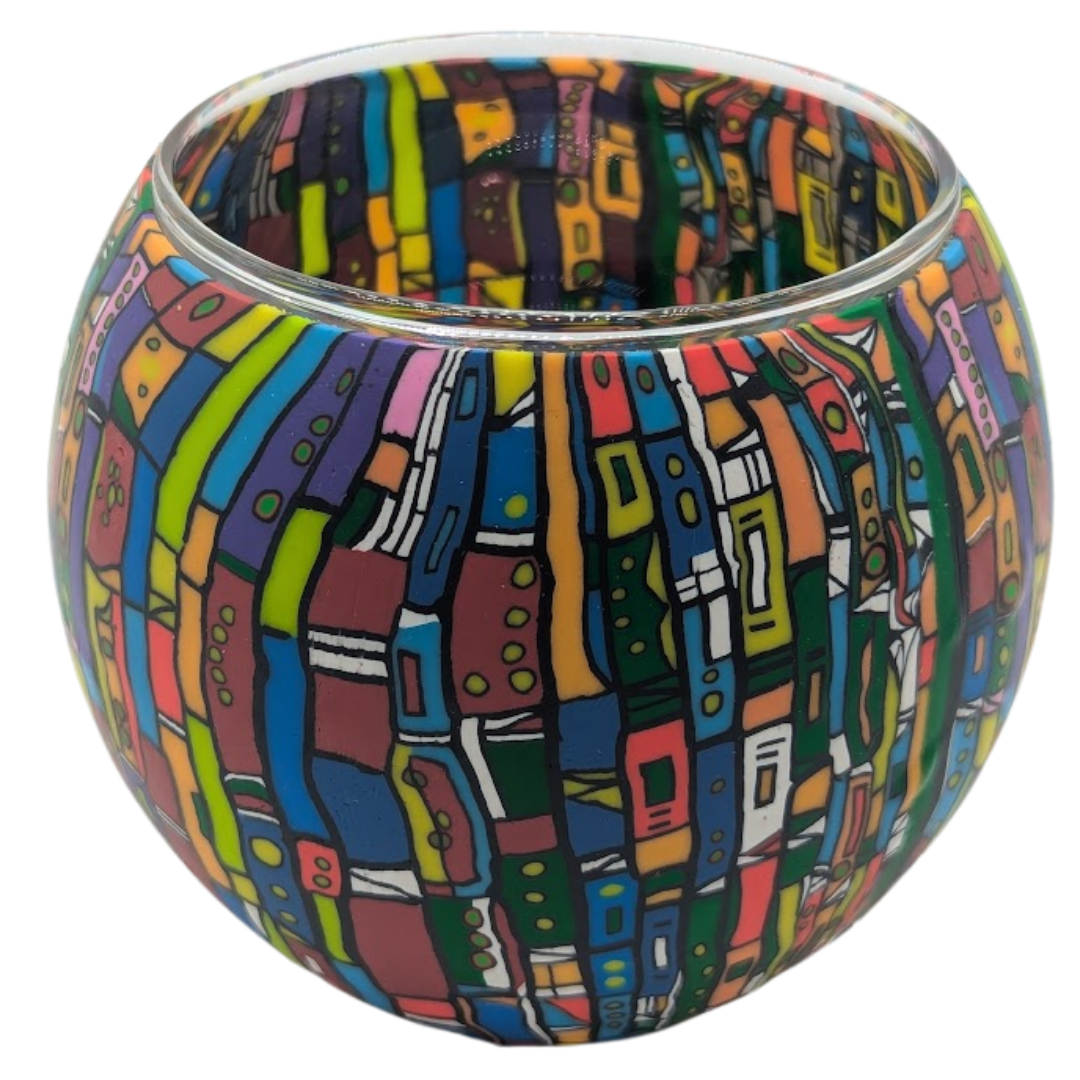 Colorful patterned glass bowl on a white background