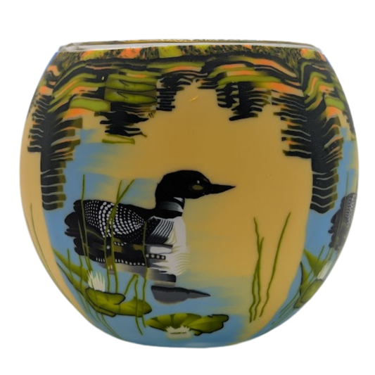 Claymaster Loon on the Lake light globe with a loon gliding among lily pads and reeds under an amber sunset reflection