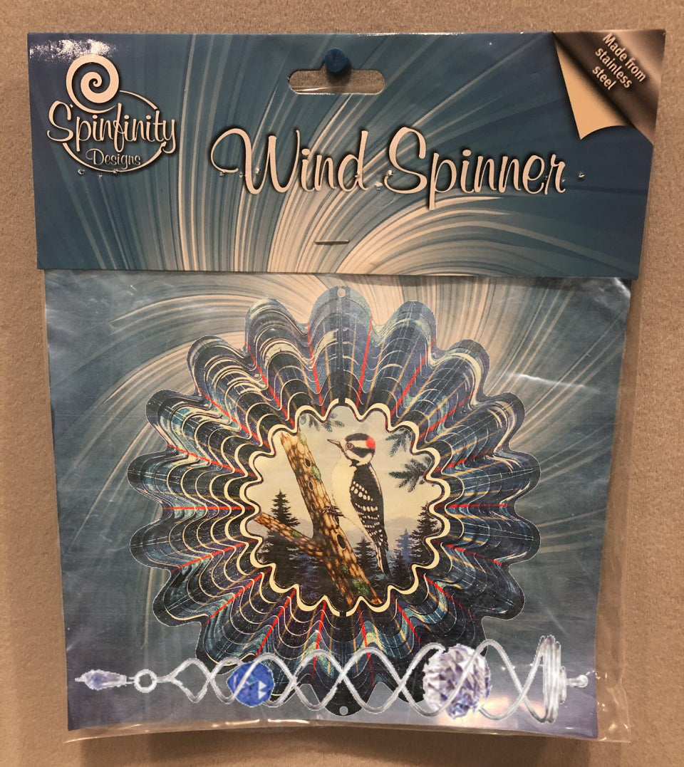 Small animated woodpecker wind spinner set in retail packaging, showing woodpecker on tree trunk centre scene and silver crystal twister with blue crystal