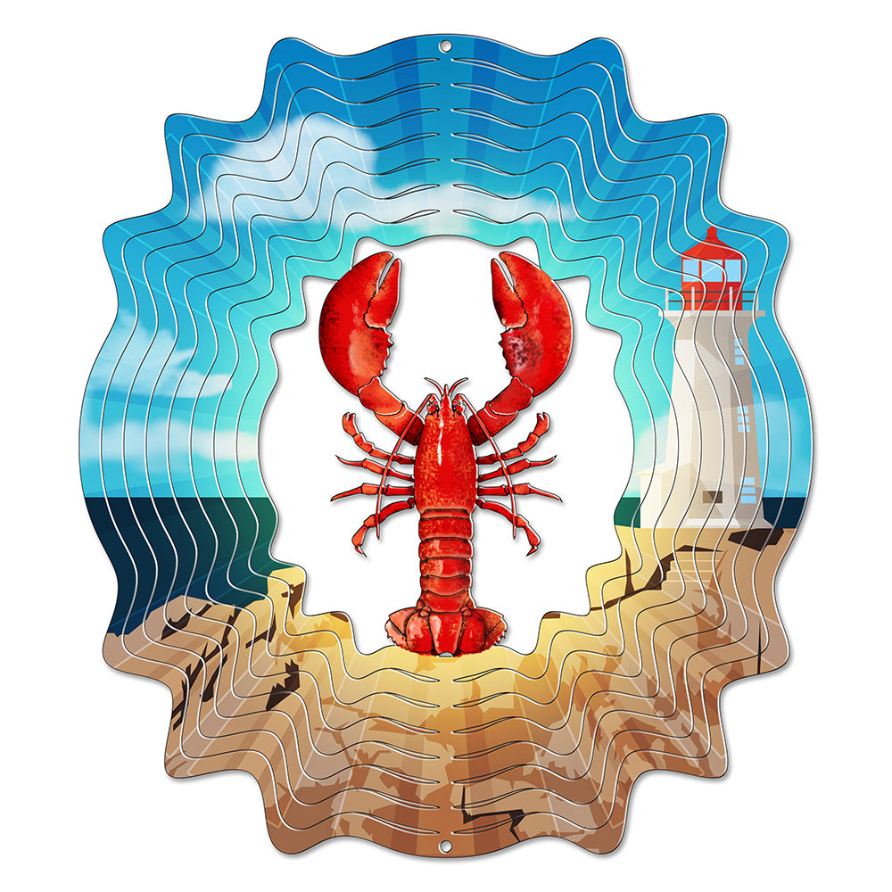 Large round wind spinner with a red lobster centrepiece in front of a white lighthouse and sandy beach, ringed by wavy layered blades